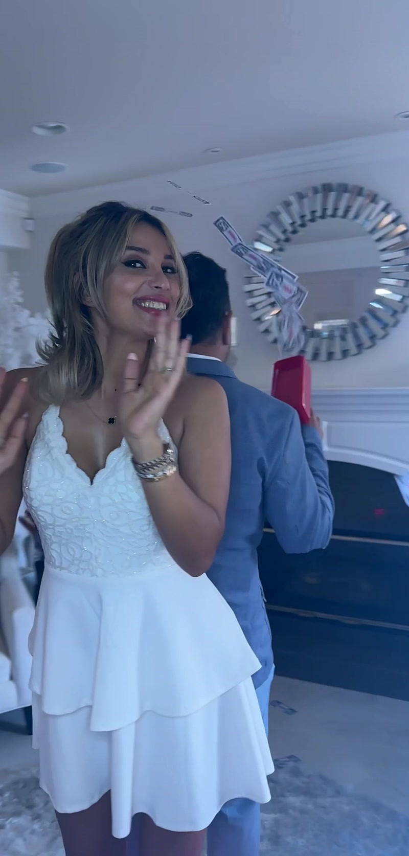 Two guests dancing at a private party, one with arms around the other